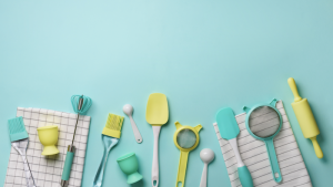 blue background with kitchen utensils laid out