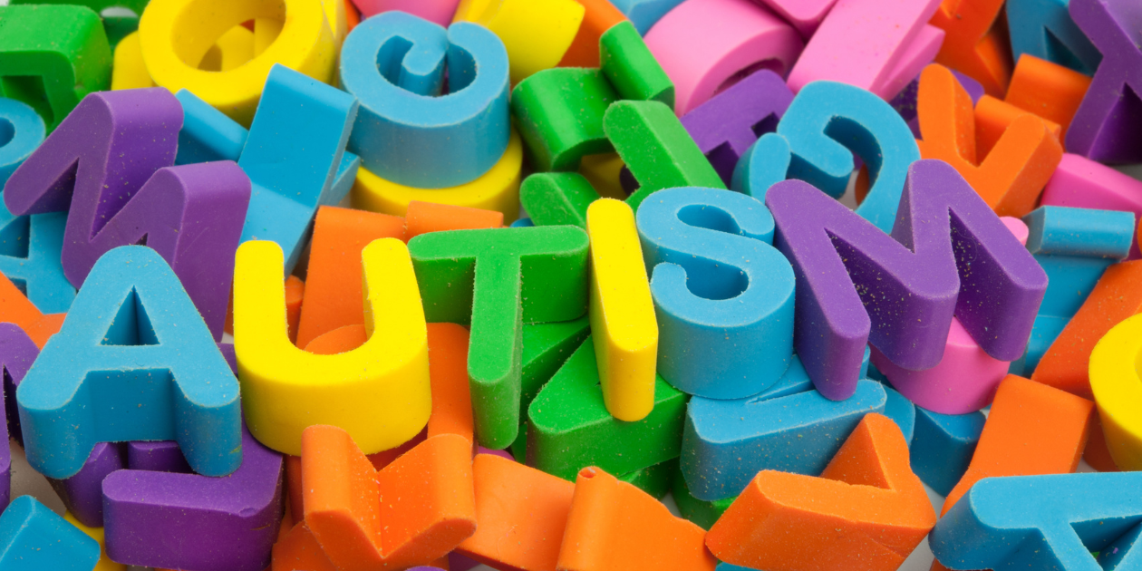 The word autism spelled out in block letters