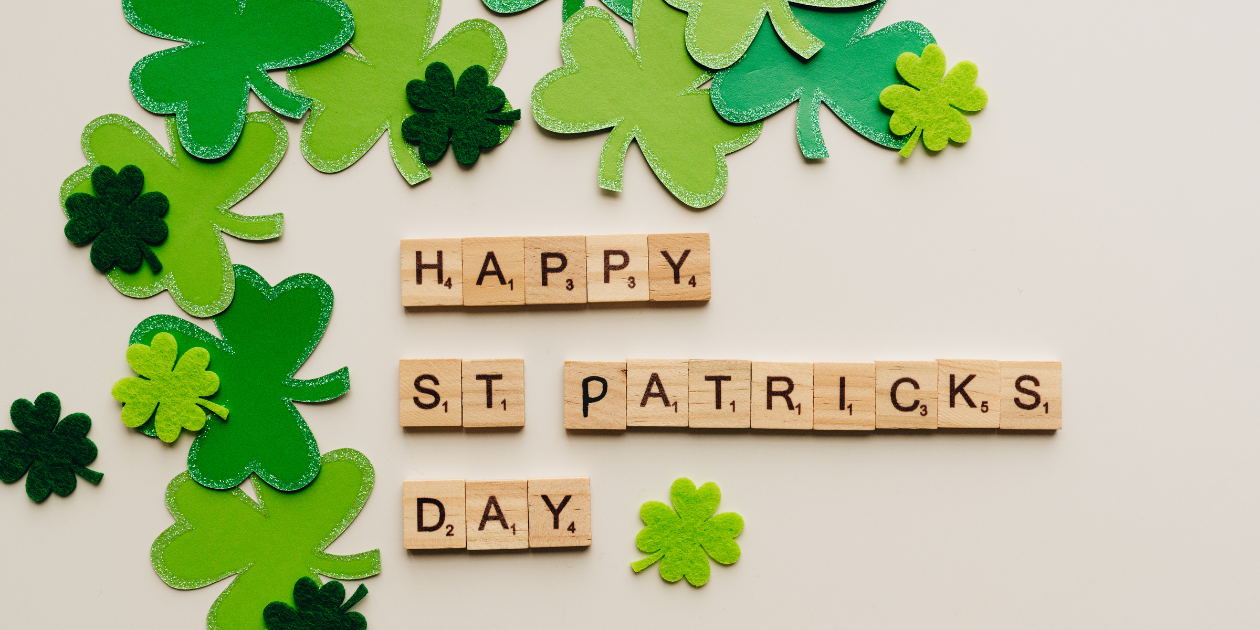 Tile letters spelling out happy st patricks day with clovers