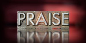 the word praise spelled out in print blocks